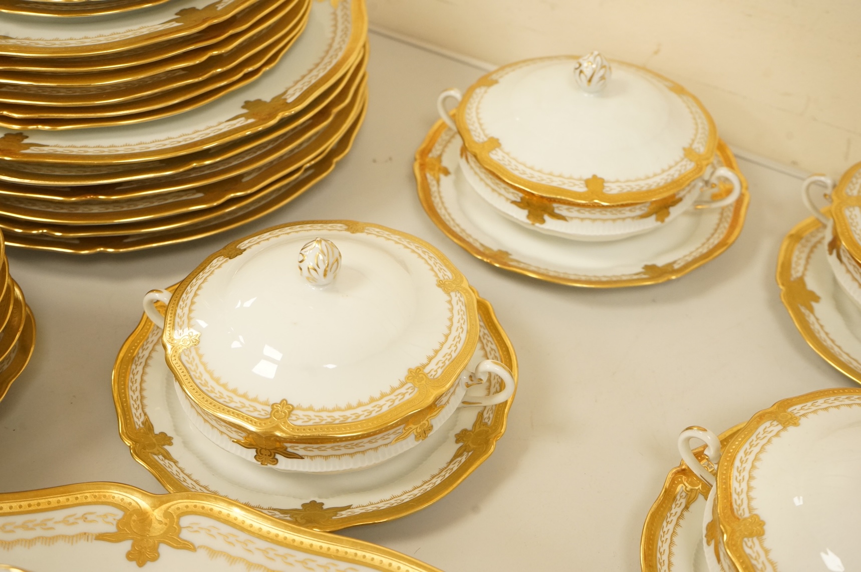 A Haviland Limoges dinner service with gilt border